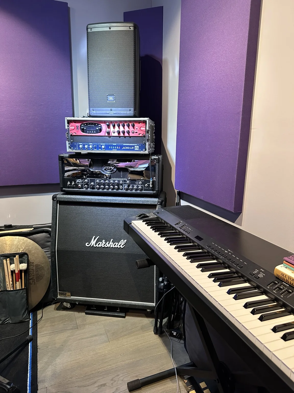 Guitar amplifiers and a keyboard in the recording room
