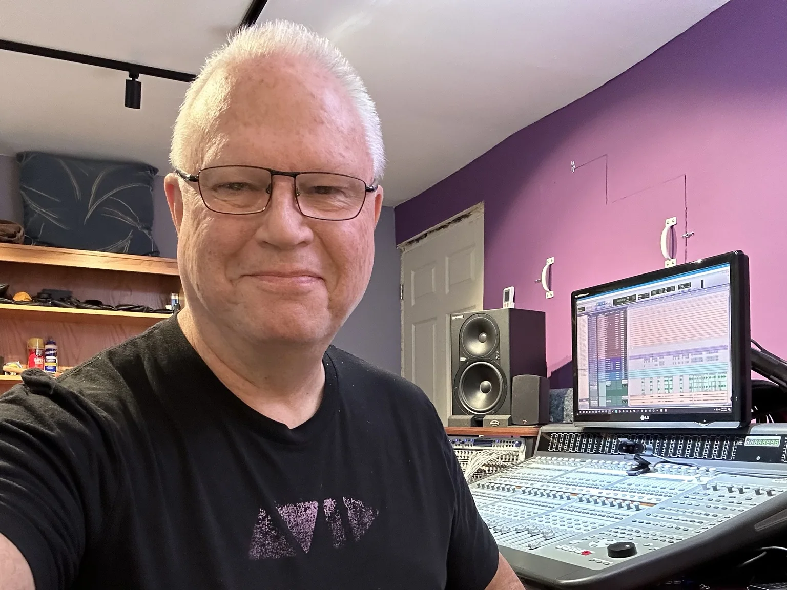 Steve Demetrician seated at the studio mixing console