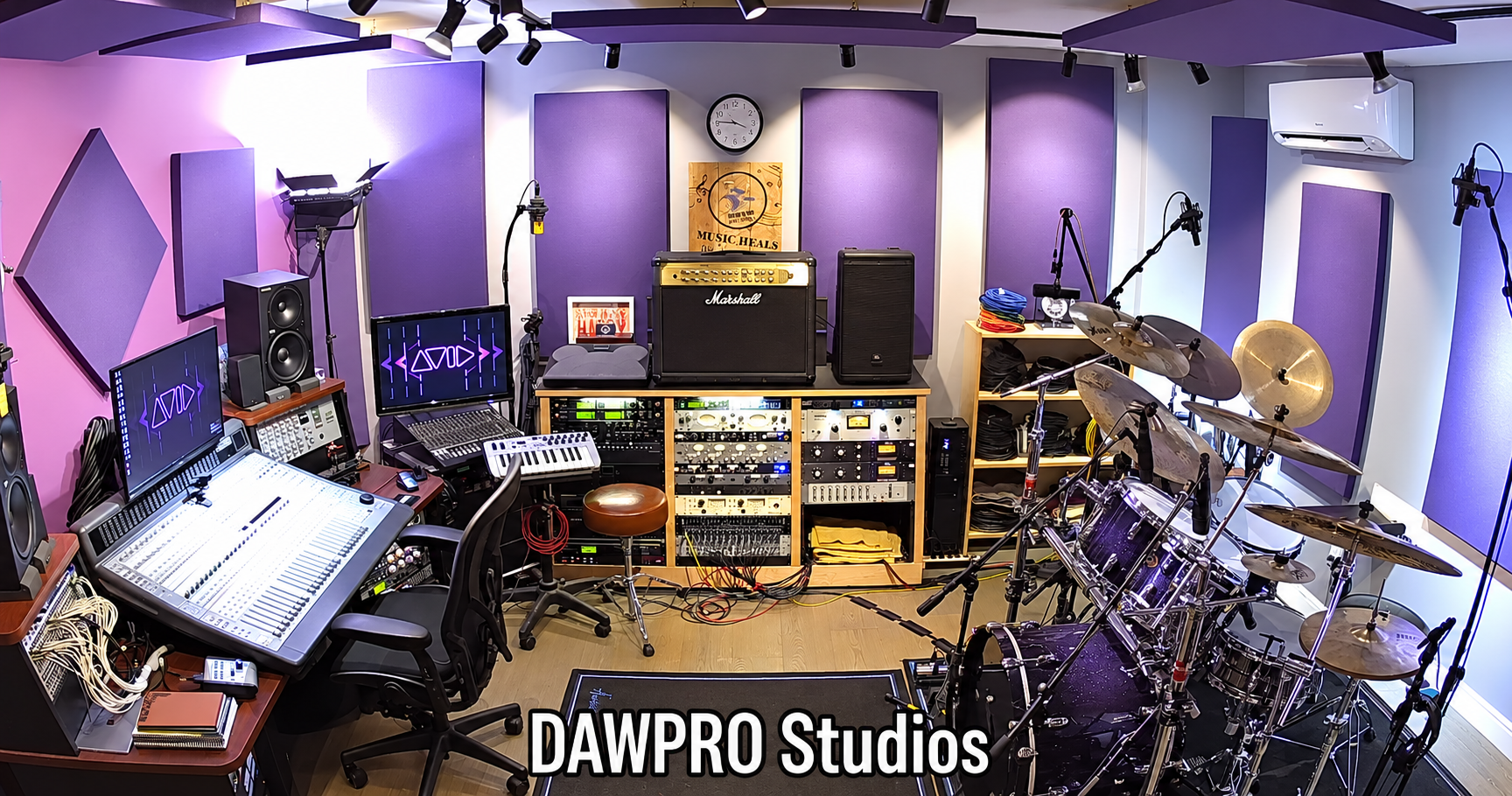 A wide view of the DAWPRO recording room, console and drum kit