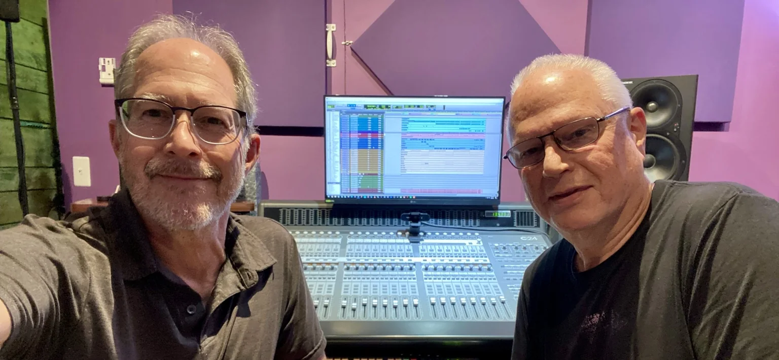 Two musicians at the DAWPRO mixing console